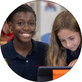 Two lower school girls smiling