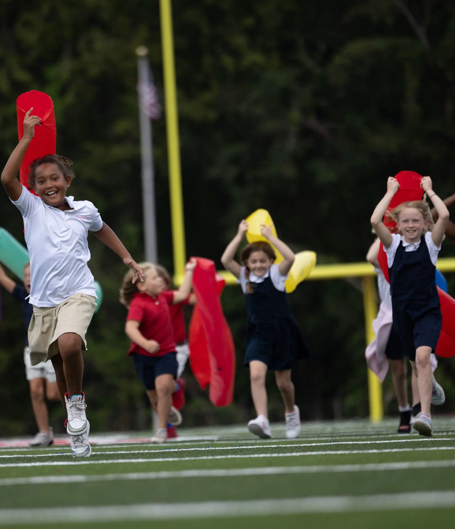 Students smiling and jumping