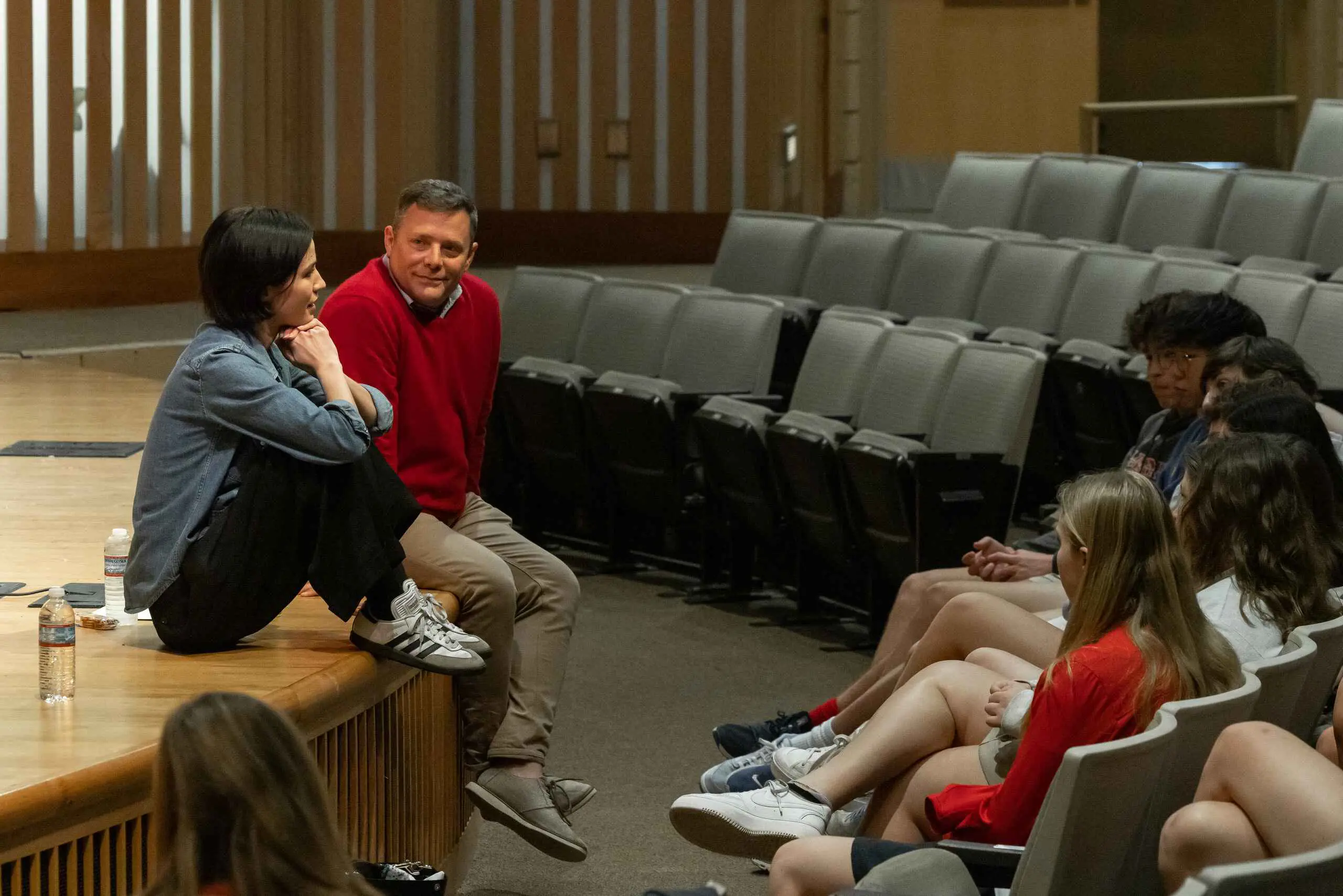 Students talking with teacher