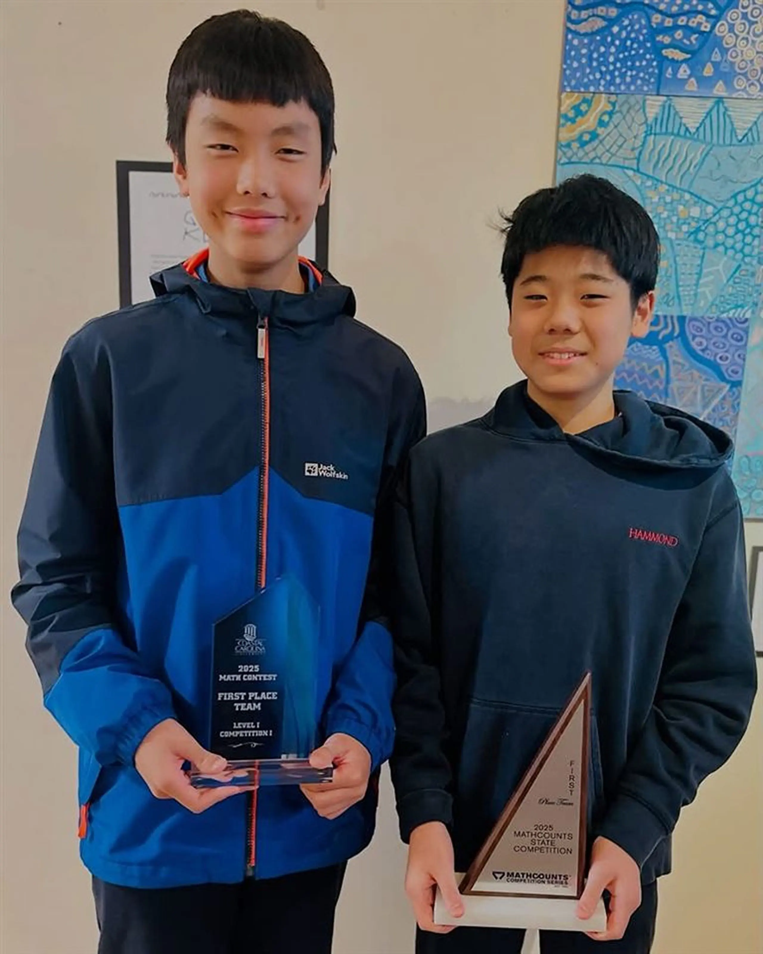 Students holding trophies