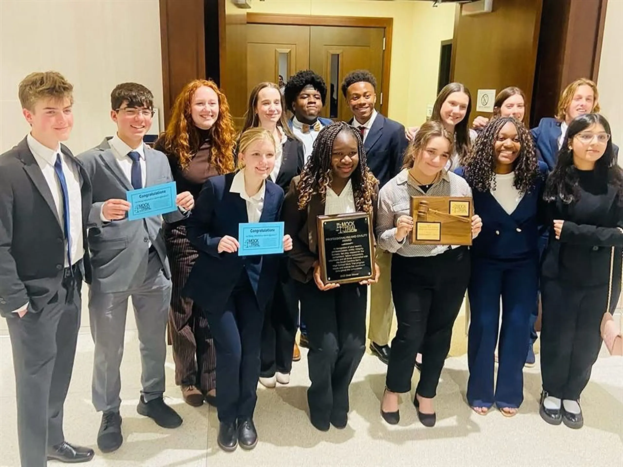 Students holding certificates