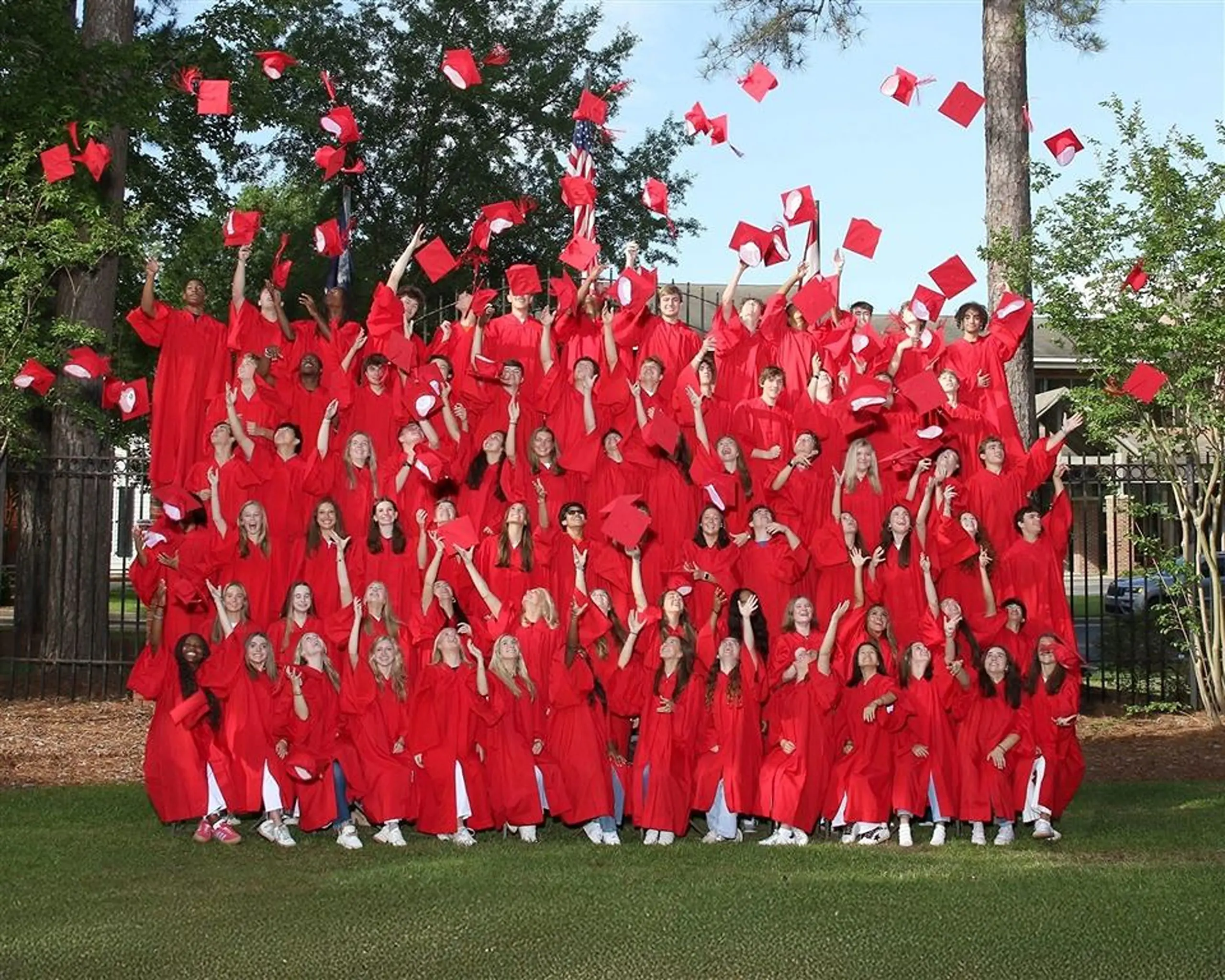 Graduating students throwing their hats in the air.